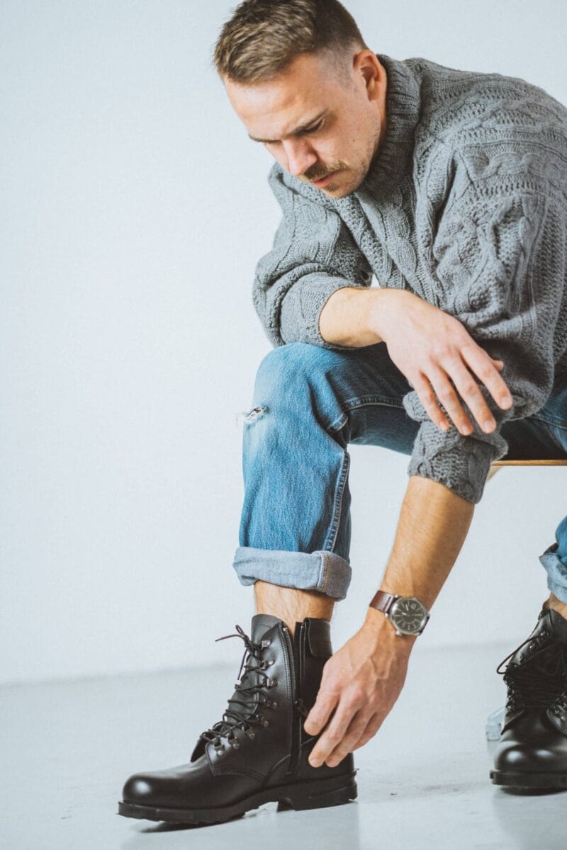 Man wearing black Samelin Hawk pilot military leather boots with side zipper and lace-up design in casual outfit