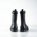 Black high aviator leather boots rear view showing pull tabs, reinforced heel, and rugged rubber outsole for durable military-style wear