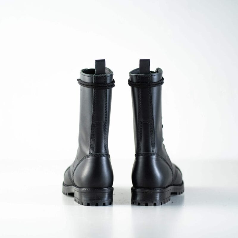 Black high aviator leather boots rear view showing pull tabs, reinforced heel, and rugged rubber outsole for durable military-style wear