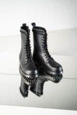 Black high aviator leather boots pair front angled view with lace-up design, reinforced toe, and rugged lug sole for durable military-style wear