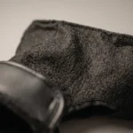 Macro view of black Samelin M77 combat inner socks showing soft insulated lining and tactical winter boot liner texture.