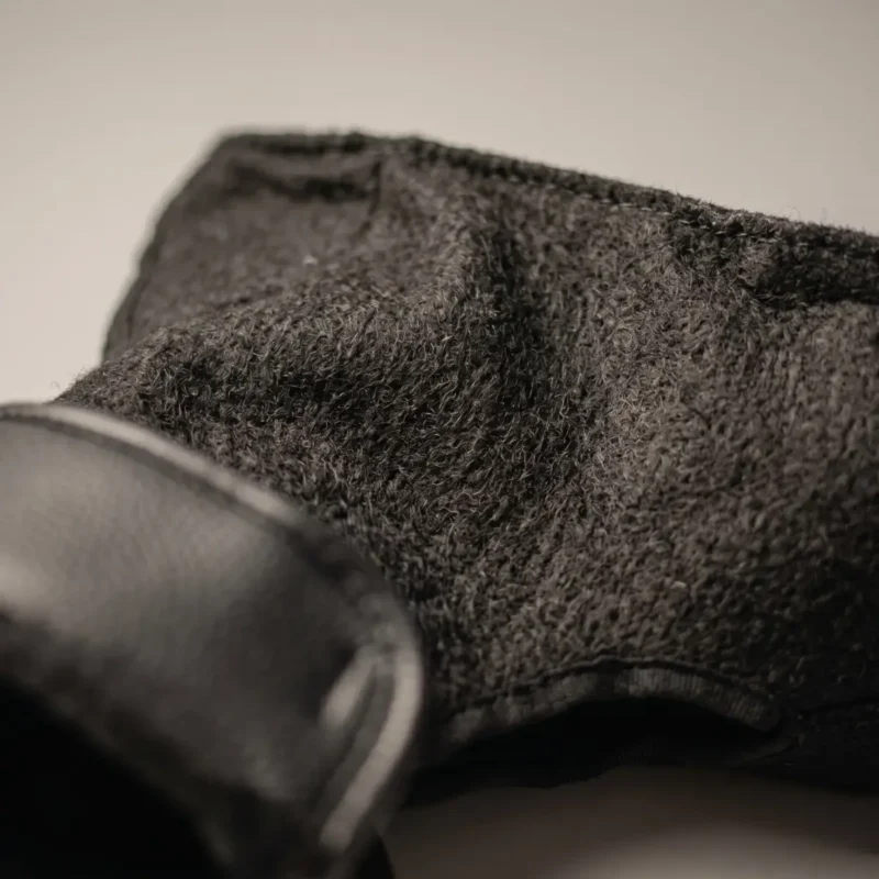 Macro view of black Samelin M77 combat inner socks showing soft insulated lining and tactical winter boot liner texture.